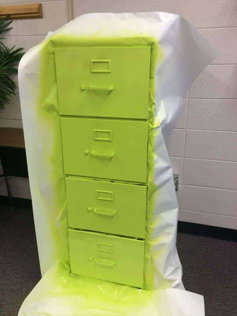 Wrap some bulletin board or butcher paper around the drawers before you paint. Filing cabinet makeover by Rhoda Design Studio