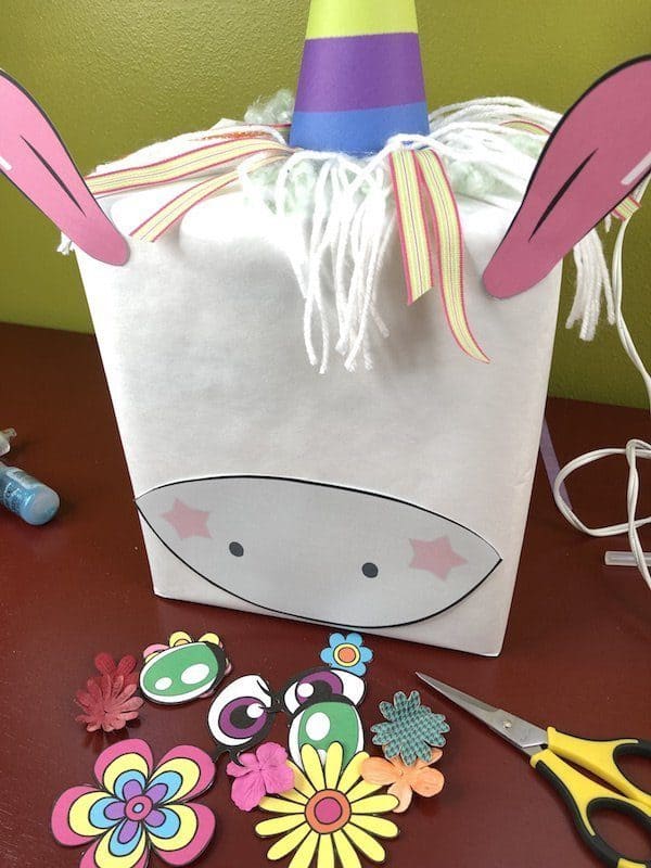 Create a whimsical and fun unicorn Valentines box for your child or students. Use the free printable to make a quick and easy unicorn craft project.