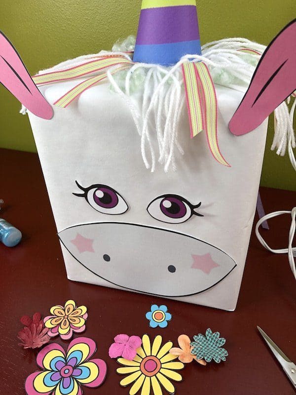 Create a whimsical and fun unicorn Valentines box for your child or students. Use the free printable to make a quick and easy unicorn craft project.